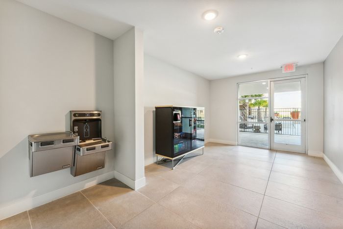 Conveniently located water fountains and vending machines near the swimming pool at Latitude Apartments