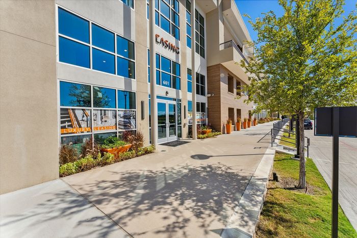 A wide sidewalk running along the beautiful Latitude Apartments community