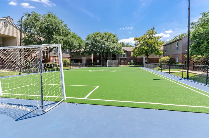 Outdoor soccer field with a well-maintained surface at a Plano, TX apartment community.