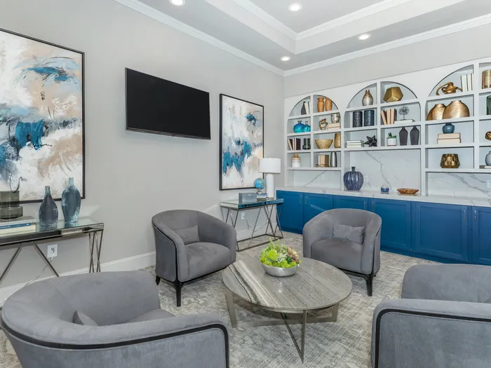 Spacious Community Club House with comfortable chairs and natural lighting from large windows