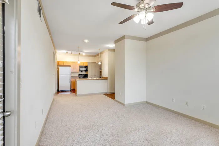Bright and spacious living room with modern furnishings at Riverside at Rockwater, North Little Rock, AR