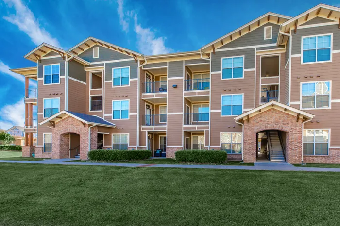 Beautiful view of the Riverside at Rockwater apartment building with scenic surroundings in North Little Rock, AR
