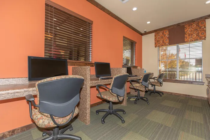 Spacious business center with computers and workstations at Riverside at Rockwater, North Little Rock, AR