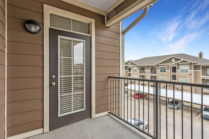Spacious private patio with scenic views at Riverside at Rockwater, North Little Rock, AR