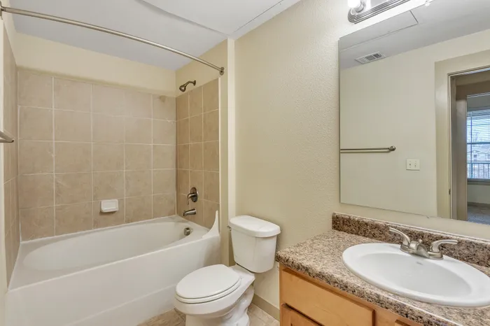 Luxury bathroom with modern fixtures and stylish tile design at Riverside at Rockwater, North Little Rock, AR