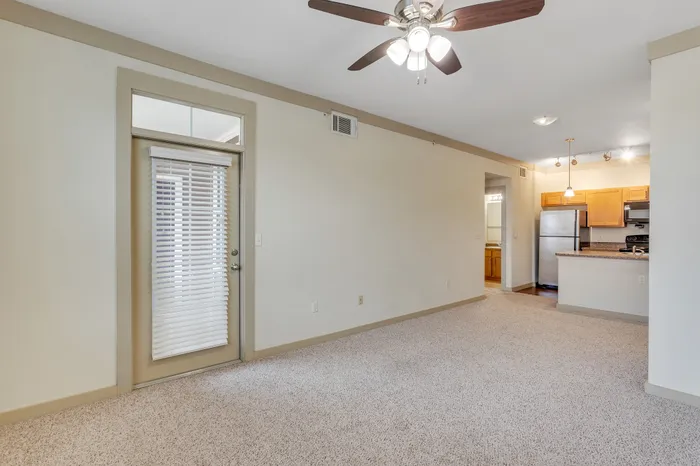 Soft, plush carpeted floors in a stylish living room at Riverside at Rockwater, North Little Rock, AR
