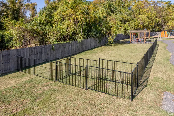 Spacious and fenced dog park at Riverside at Rockwater, North Little Rock, AR, with plenty of room for pets to play