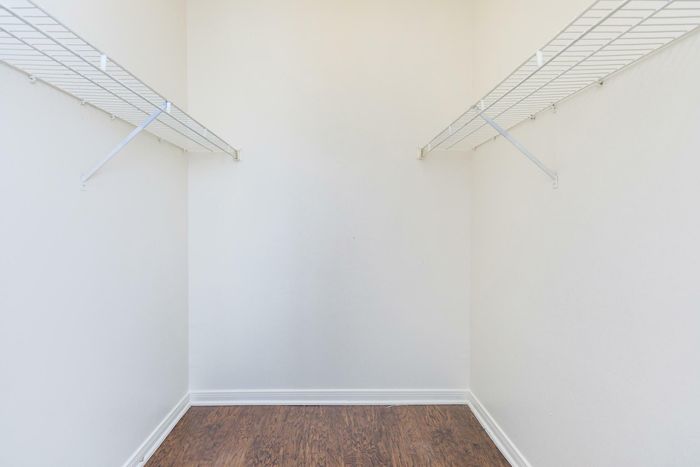 Large walk-in closet with ample storage space at Southwest Pines, Tyler, TX