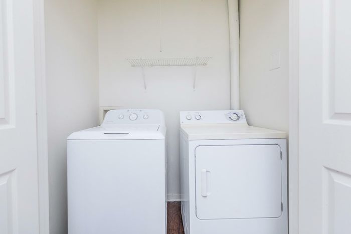 Washer and dryer unit in a modern home at Southwest Pines Apartments in Tyler, TX