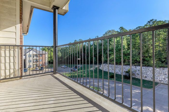 Enjoy the scenic views from the spacious balcony and patio at Southwest Pines in Tyler, TX.