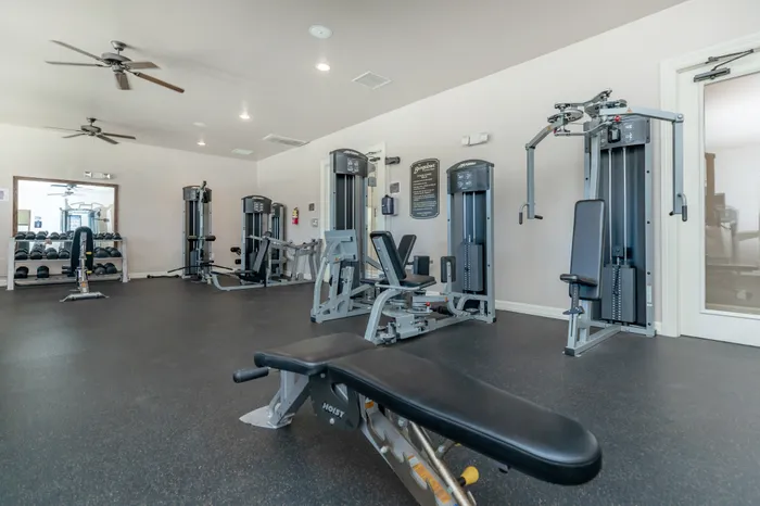 Spacious fitness center with strength and cardio equipment at Lifestyles Hueco Estates in El Paso, TX.