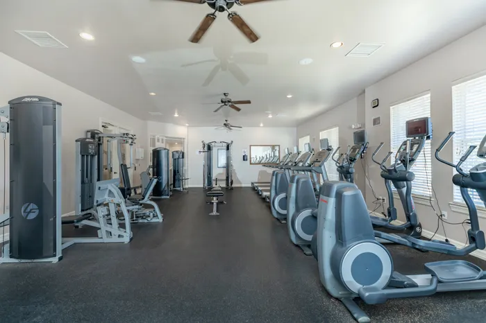 Spacious fitness center with strength and cardio equipment at Lifestyles Hueco Estates in El Paso, TX.