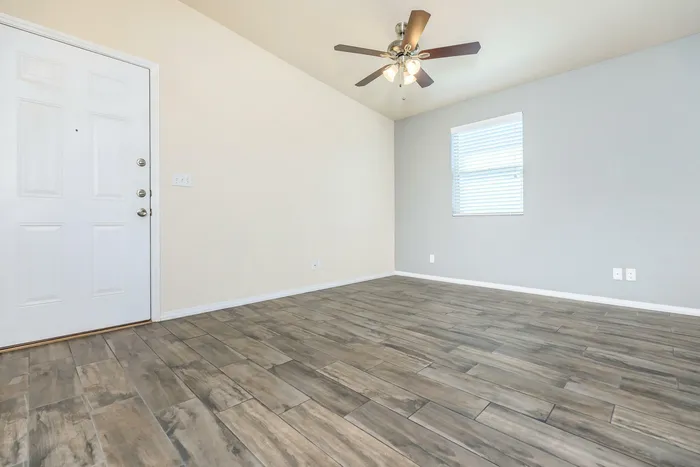 A bright and spacious living room with modern furniture and large windows at Bella Vista Place, El Paso, TX