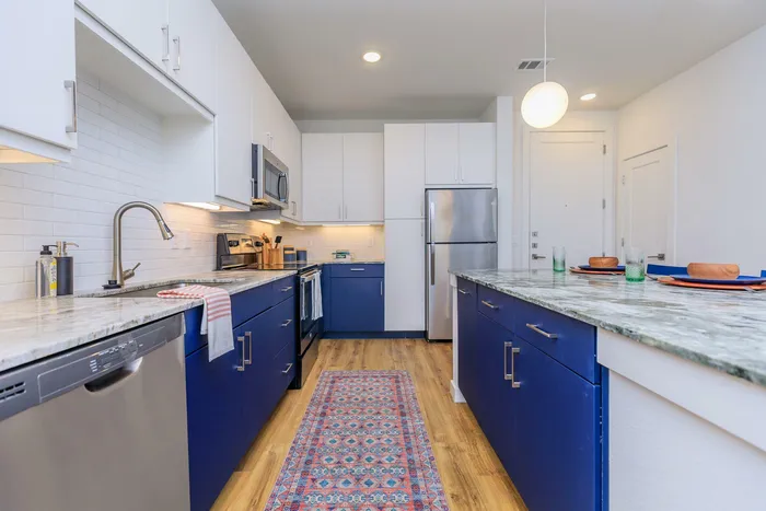 blue counters and stainless steel appliances