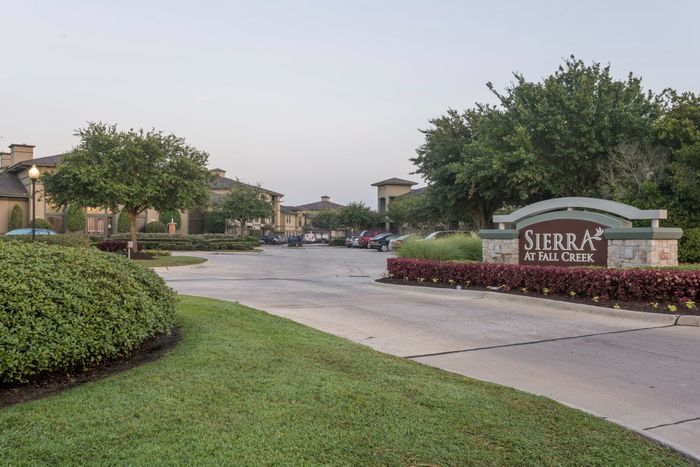 a road leading to the Sierra at Fall Creek community as notified by a large sign