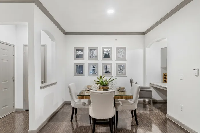 dining room with lighting, a table, and chairs