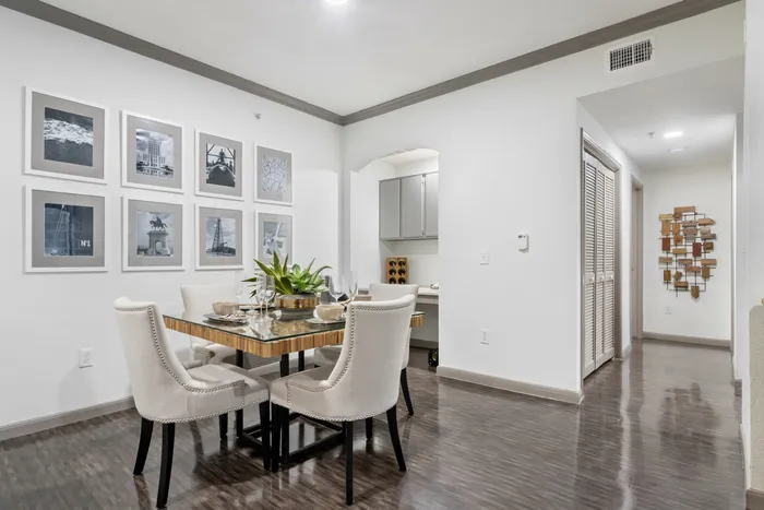 dining room with lighting, a table, and chairs