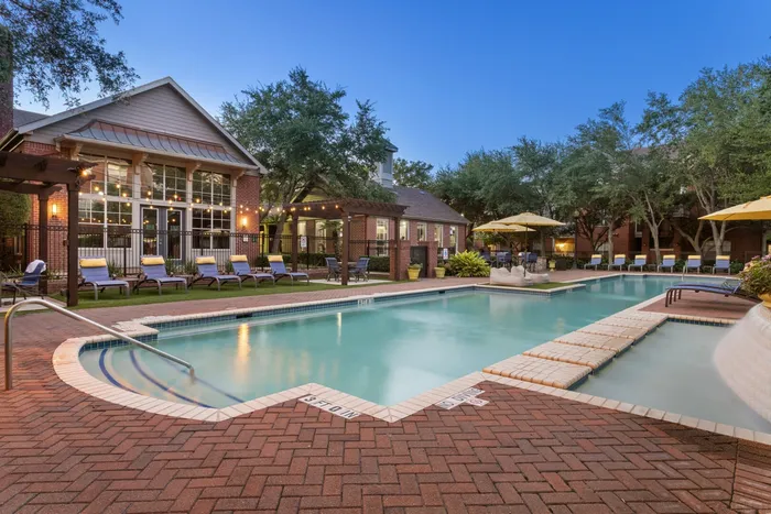 sparkling swimming pool with poolside seating
