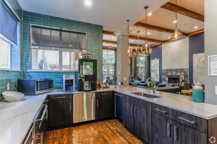 modern kitchen with a coffee maker, seating, and natural lighting
