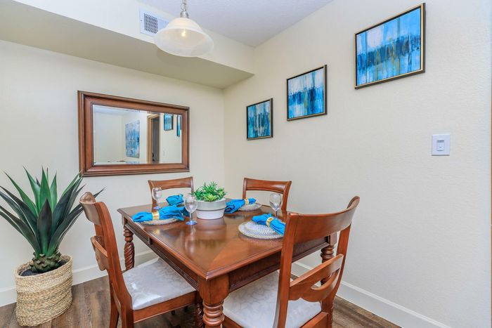 a cozy dining room at Whispering Pines Apartments in El Paso, TX