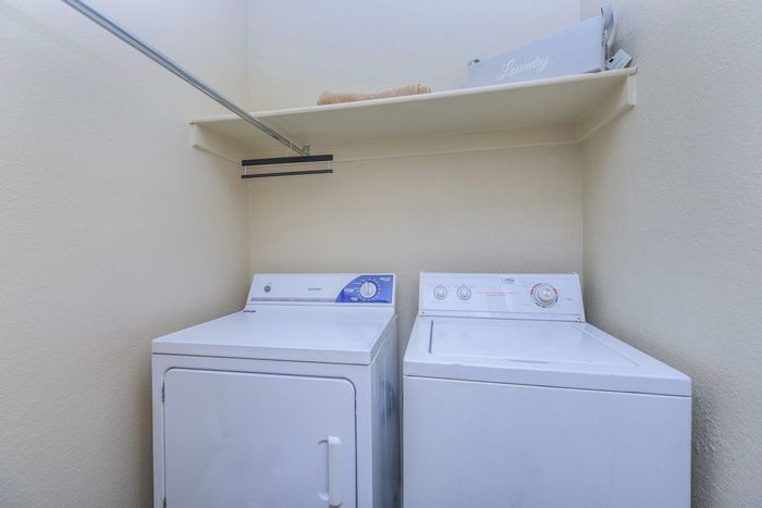 a washer and dryer inside an apartment at Whispering Pines in El Paso, TX