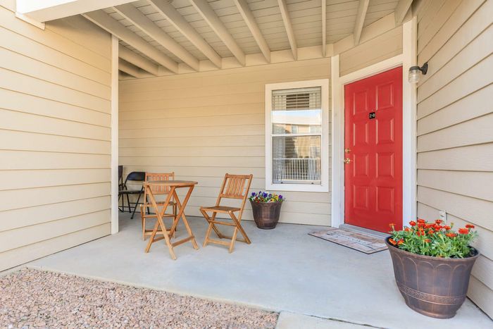 a spacious outdoor patio with plenty of room for sitting at Whispering Pines Apartments in El Paso, TX