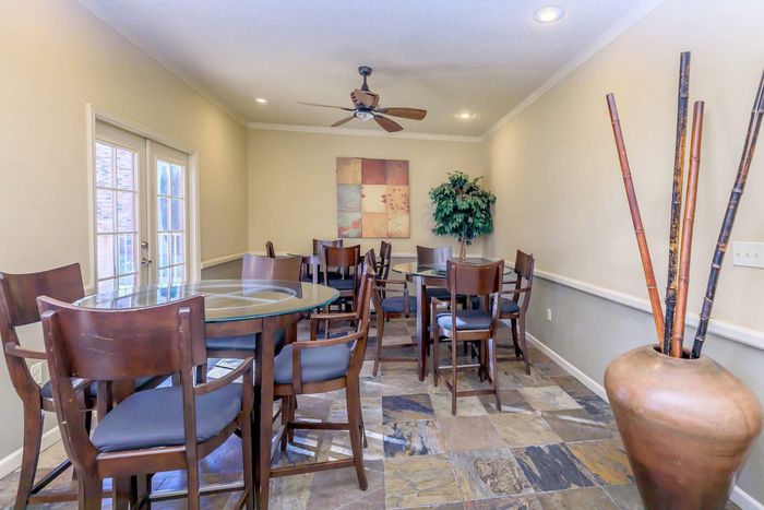 Dining area in the clubhouse at Whispering Pines Apartments