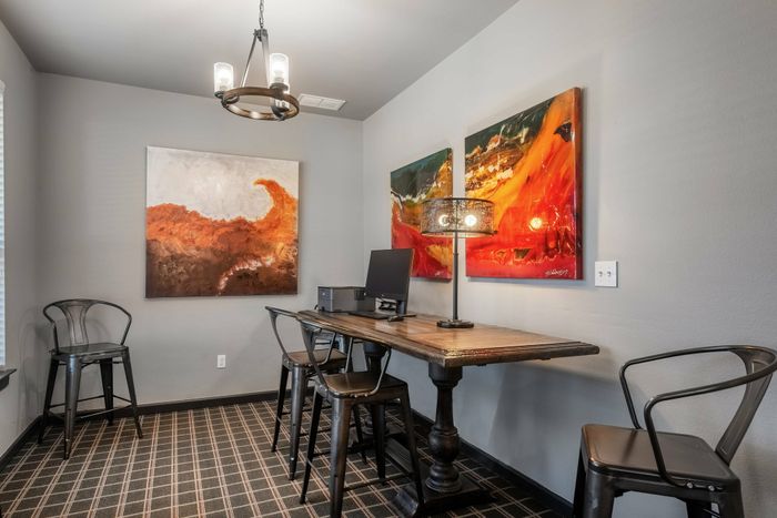 Well-equipped business center in a Carrollton, TX apartment community with modern furnishings.