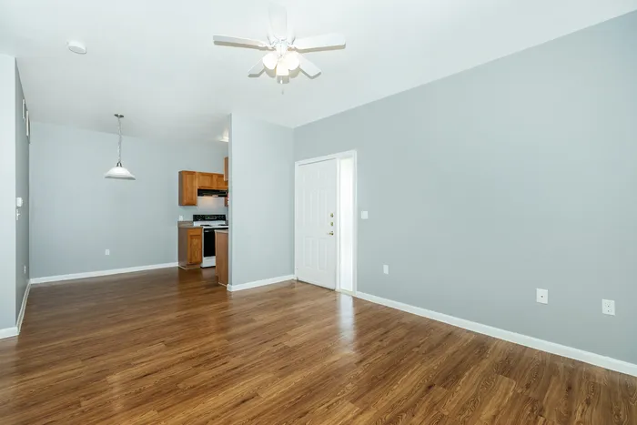 Open-concept living and dining area with modern furnishings and elegant lighting at Portside Villas, Ingleside, TX