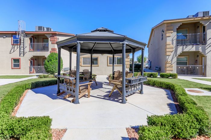 A peaceful gazebo surrounded by lush greenery at Bella Vista Place, El Paso, TX