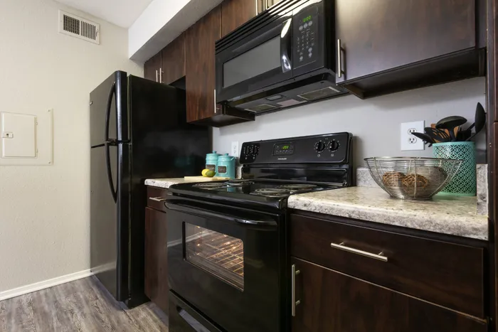 state of the art kitchen and black appliances