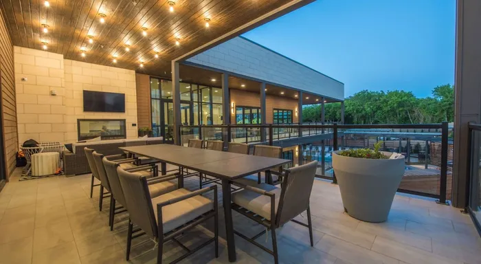 outdoor seating with bright lighting at dusk