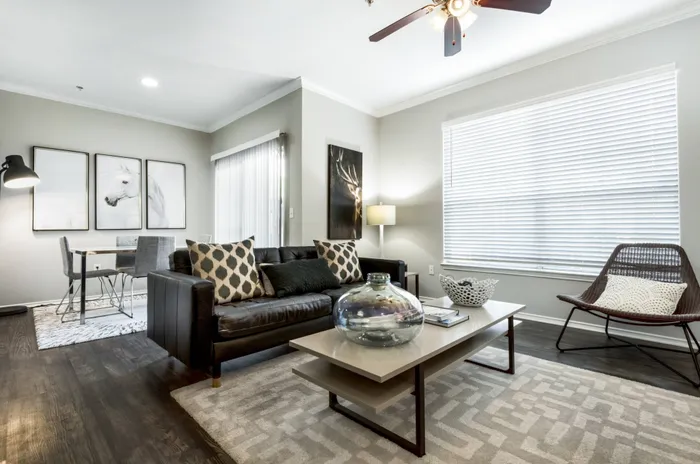 living area furnished with rugs, table, chairs, and plenty of decor