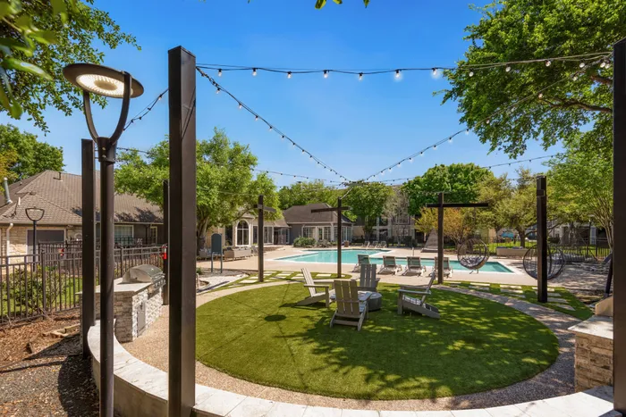 grassy area with grills and chairs