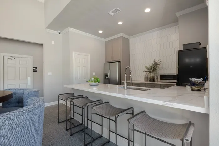 resident clubhouse with prep kitchen and a large bar
