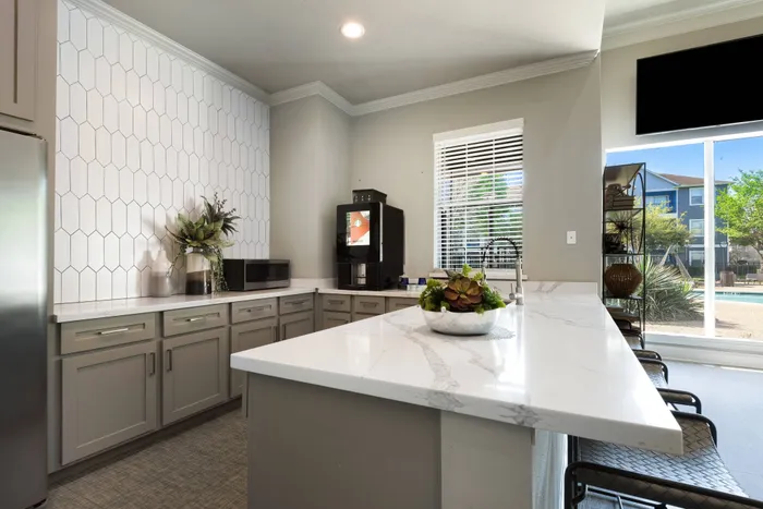 resident clubhouse with prep kitchen and a large bar