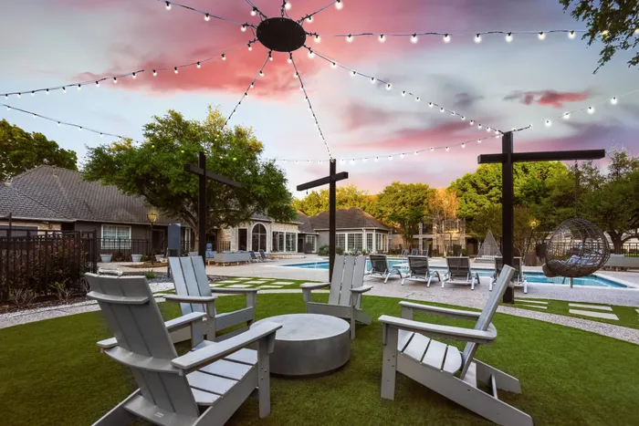 sparkling pool surrounded by large walkways and comfortable seating