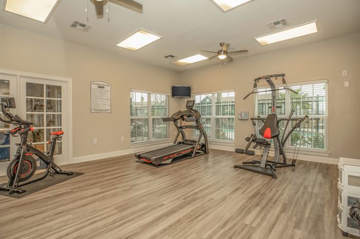 Modern fitness center with cardio machines at Sierra Royale, Robstown, TX