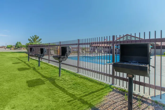 Outdoor BBQ grills near the community pool at Santa Teresa Terrace in Santa Teresa, NM.