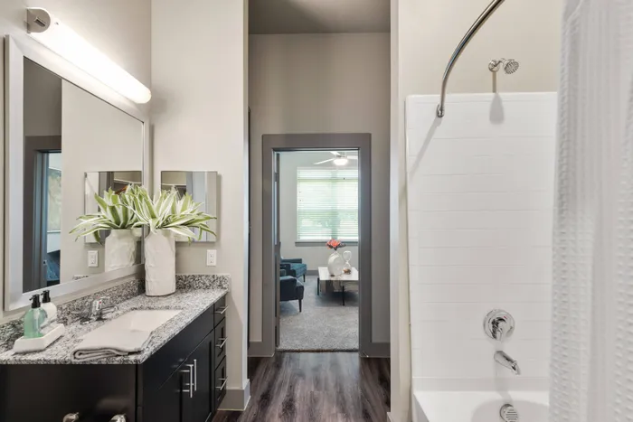 Elegant bathroom with modern fixtures and sleek design at Discovery Park in Denton, Texas.
