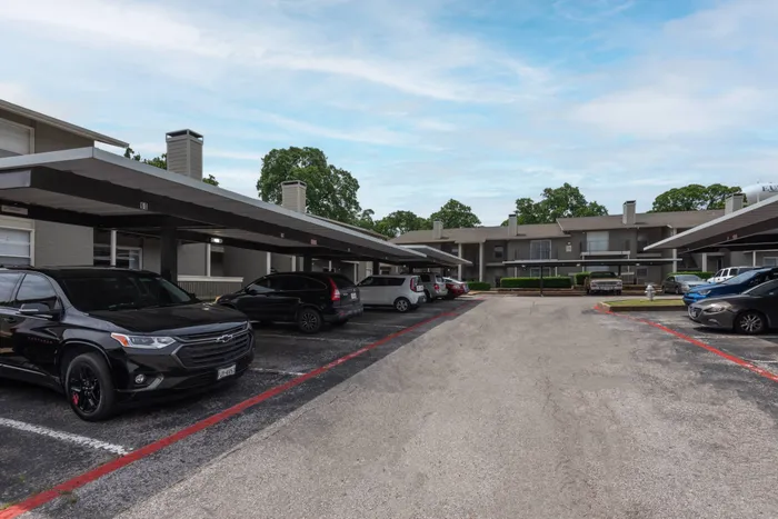 Convenient covered parking at Oak Park Apartments in Euless, TX, providing protection and easy access to your vehicle.