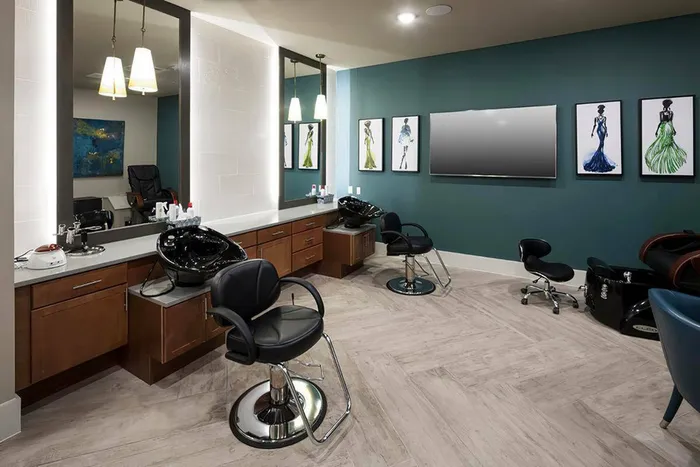 Modern salon and spa with styling chairs at McDermott 55 in Plano, TX.