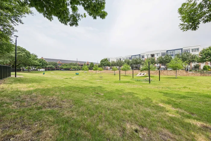 Large dog park with open fields for pets at Addison Keller Springs, Addison, TX
