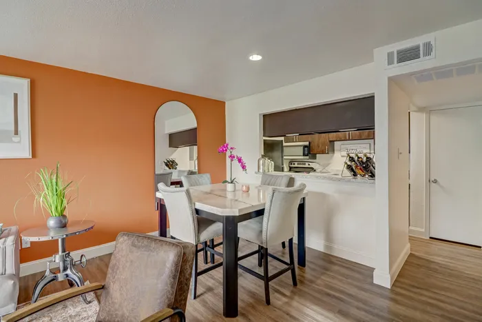 Chic dining area at Oak Park Apartments in Euless, TX, with modern furniture and vibrant decor.