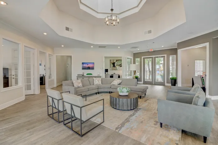 Stylish clubhouse lounge with contemporary furniture at Oak Park Apartments in Euless, TX.