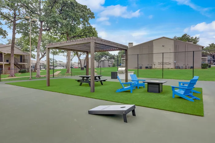 outdoor seating and cornhole