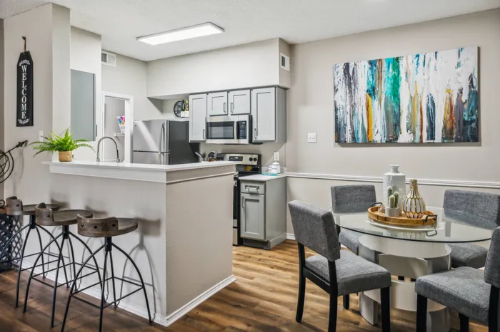 Stylish open-concept living area with unique wall decor and modern furnishings in Plano, TX.