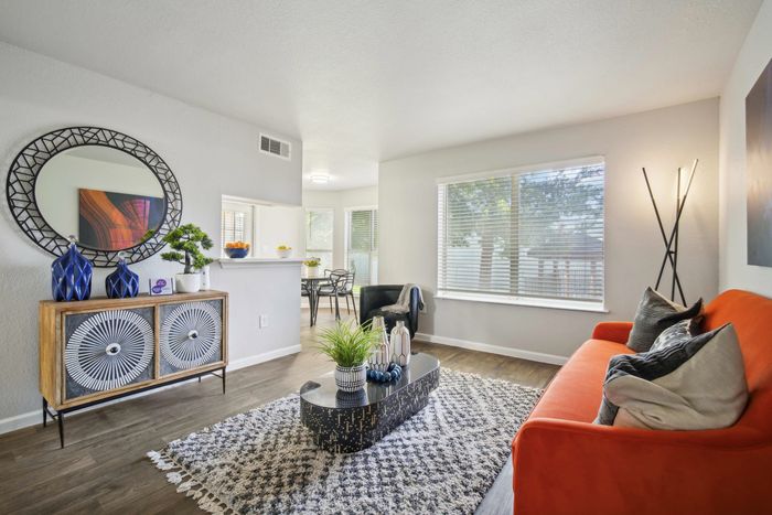 Spacious living area with contemporary design and stylish furnishings at Ovation Apartments in Austin, TX.