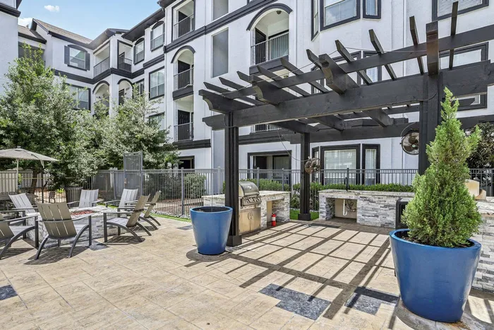 outdoor grill and cooking area with firepit