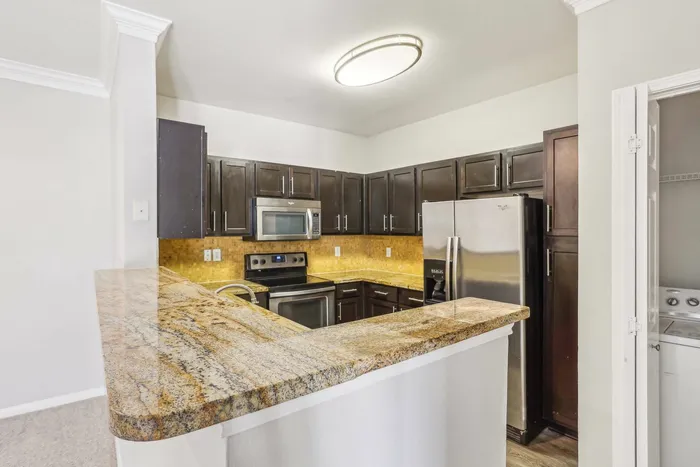 state of the art kitchen with stainless steel appliances